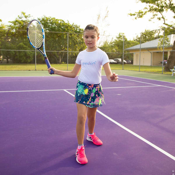 Girls tennis skort back view with splash paint mesh tennis design