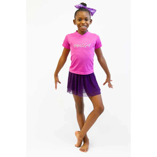 Girls tennis skort front view with fuchsia mesh design