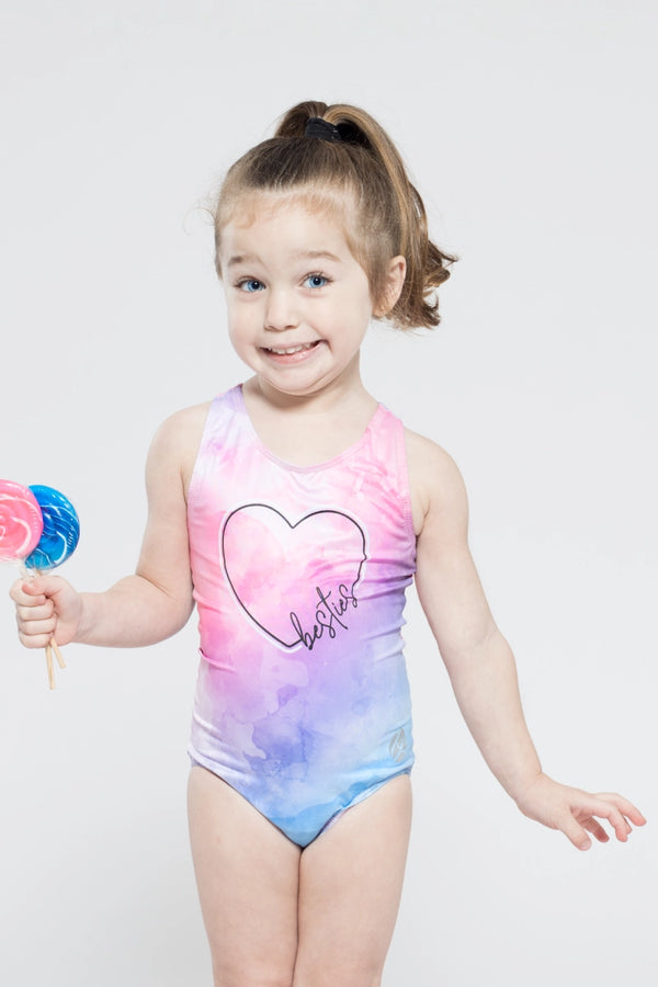 Girls gymnastics leotard front view with best friends themed print design