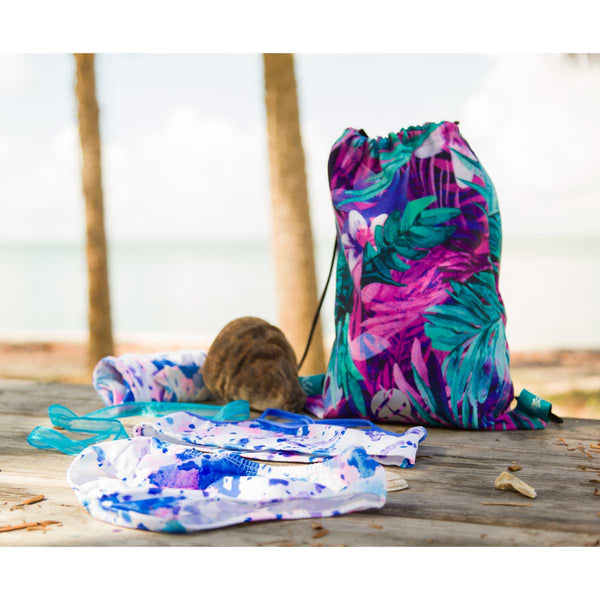 Girls drawstring backpack front view with tropical leaves print